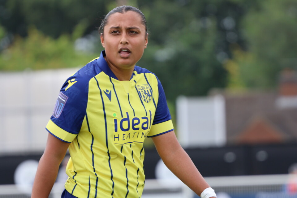 Simran Jhamat in yellow and blue.