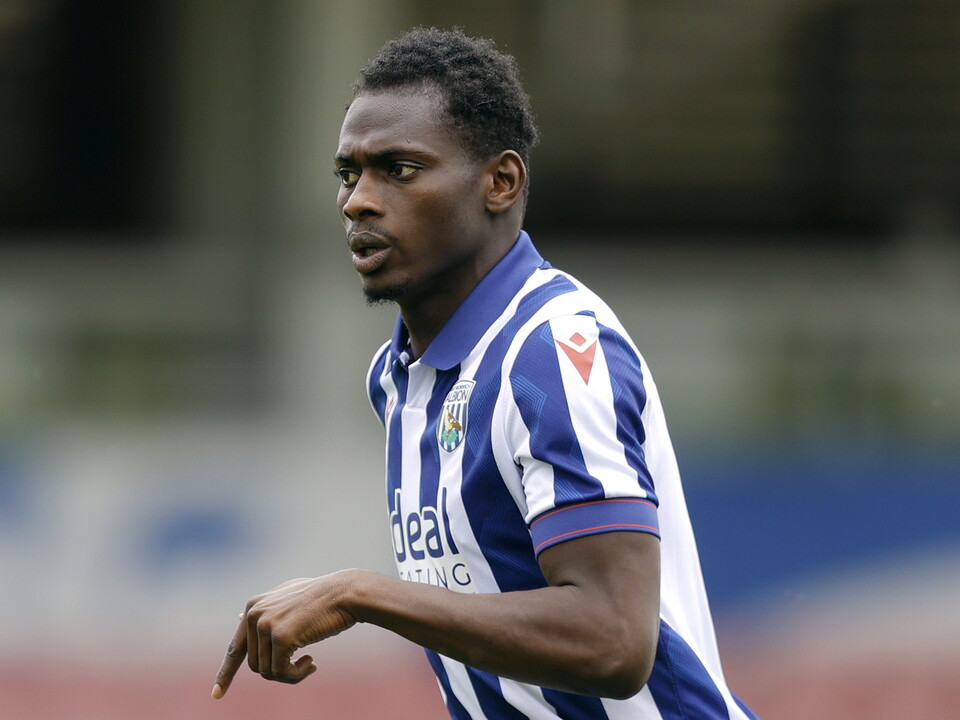 A photo of Albion midfielder Ousmane Diakite in the 2024/25 home kit