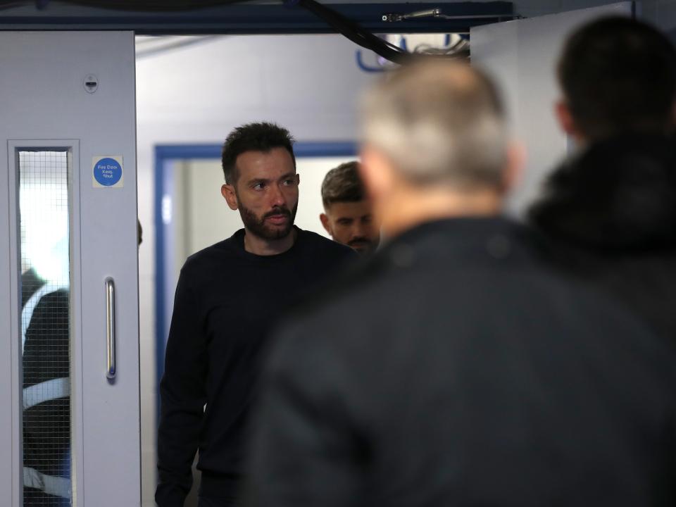 An image of Carlos Corberán arriving at Oxford's Kassam Stadium