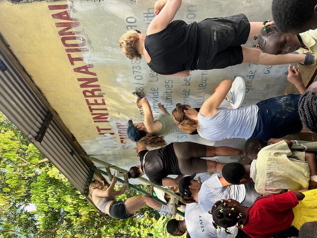 Volunteers work on a school.