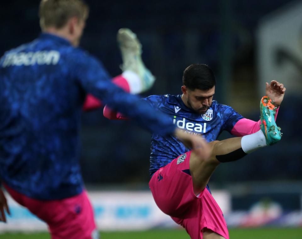 An image of Alex Mowatt warming up ahead of Blackburn