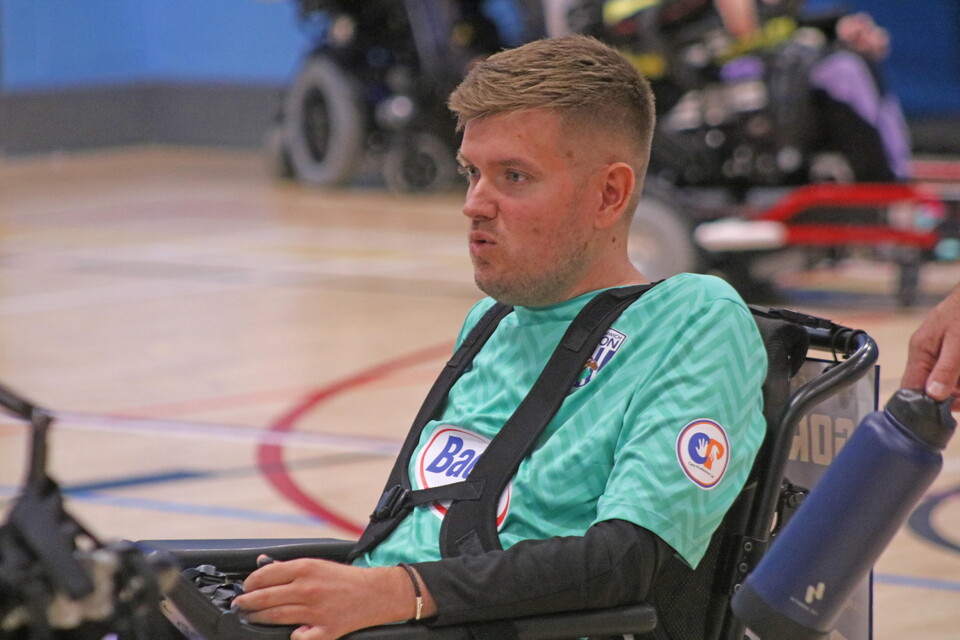 Chris Gordon player in goalkeeper kit with Care Preference sponsor on sleeve