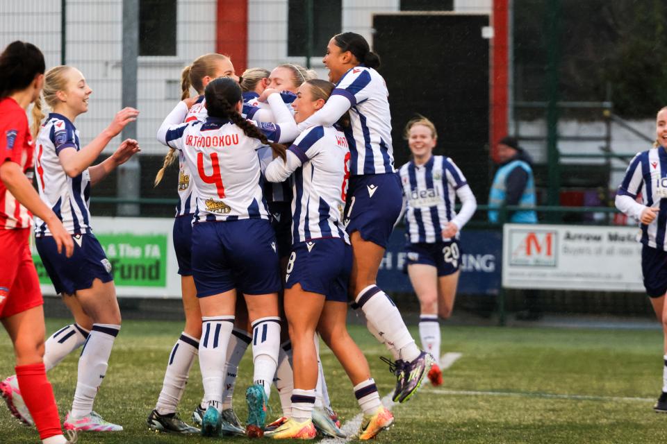 Several Albion players celebrate a goal in the home kit against Cheadle Town Stingers 
