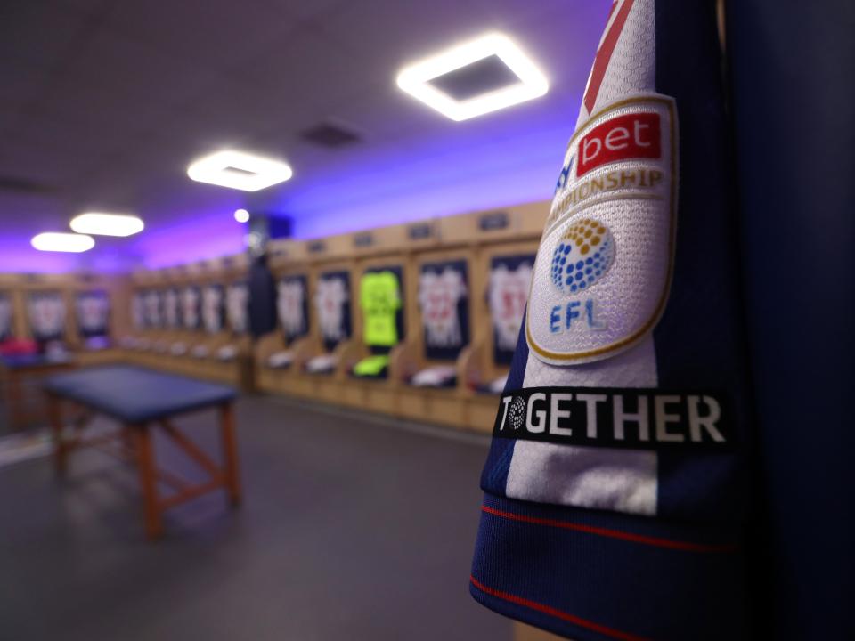 An image of shirts hanging in The Hawthorns dressing room