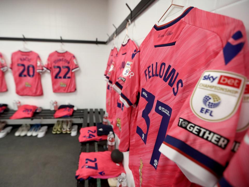 An image of Tom Fellows' pink shirt hanging up in the Derby away dressing room