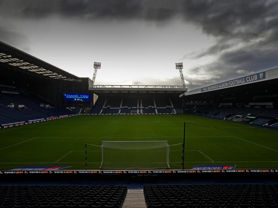 An image of The Hawthorns under a cloudy, dark sky