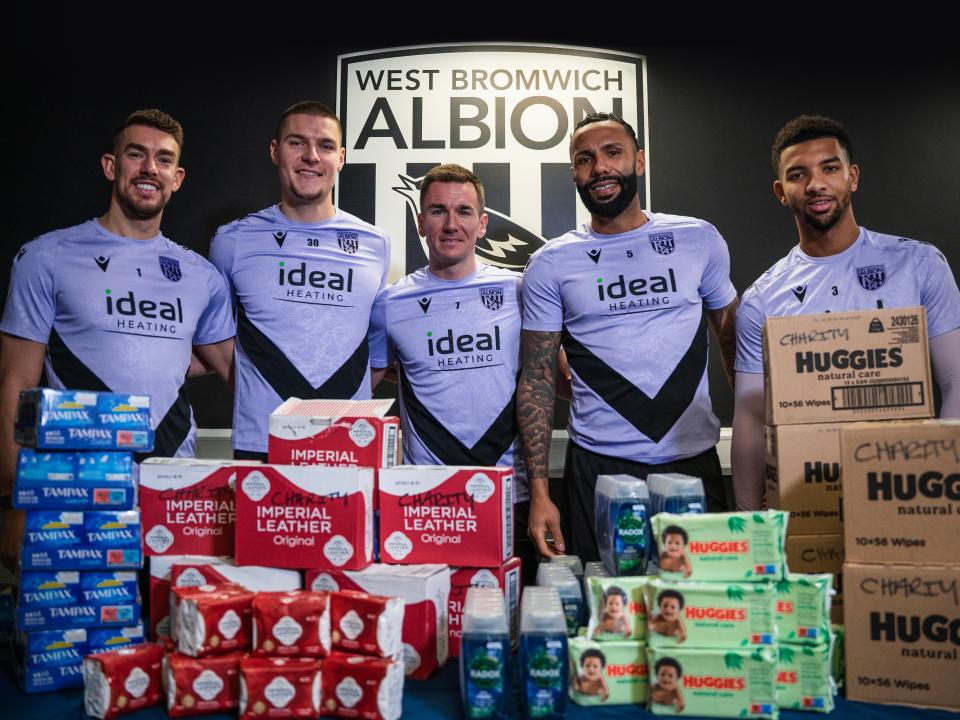 An image of Alex Palmer, Ted Cann, Jed Wallace, Kyle Bartley and Mason Holgate with hygiene items they have donated to the multibank