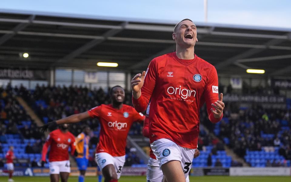 Caleb Taylor celebrates scoring for Wycombe at Shrewsbury 