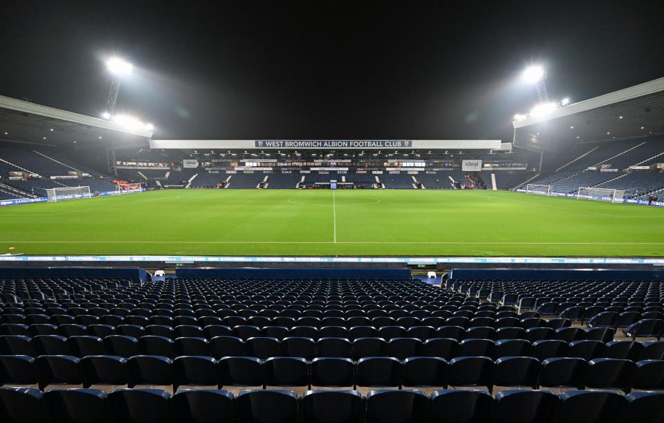 A general view of the West Stand at The Hawthorns at night with the floodlights on 