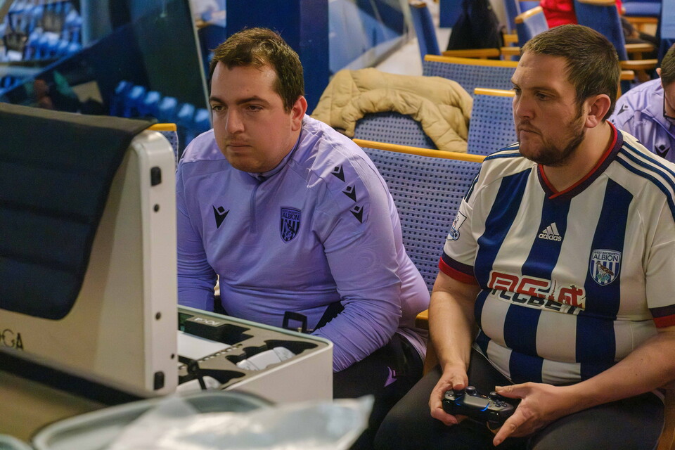 PANS participants playing on a console at the SEND Hub.