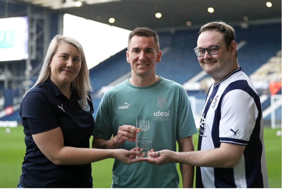 Jack and Vicky posing with Albion captain Jed Wallace.