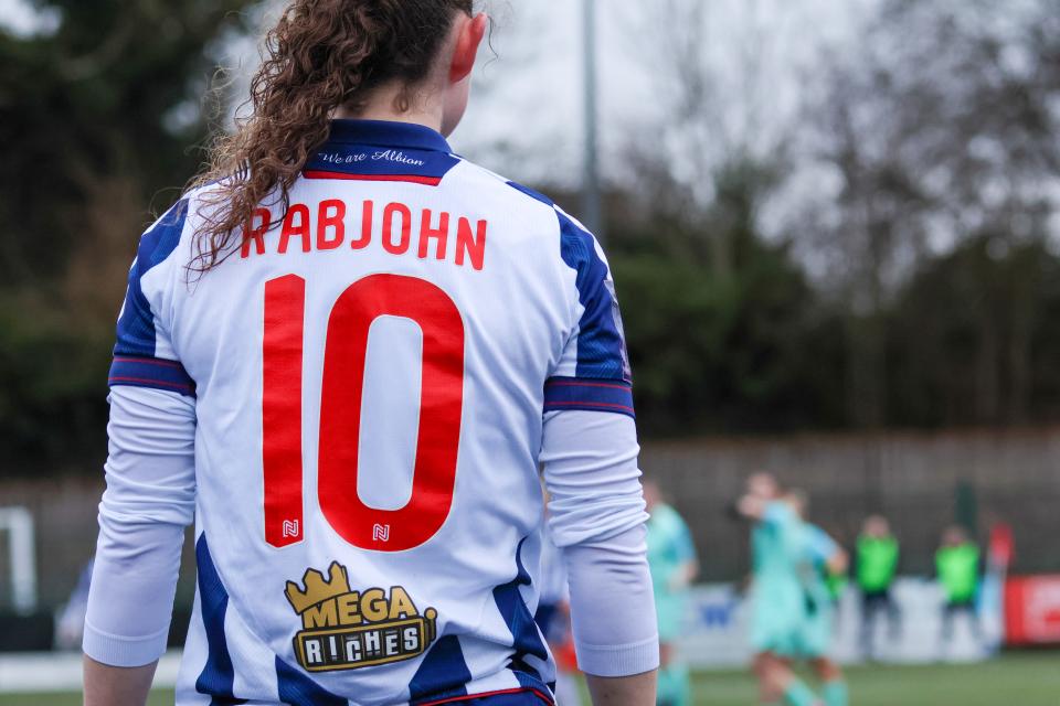 Liv Rabjohn in action for Albion Women with her name and humber 10 shirt on show