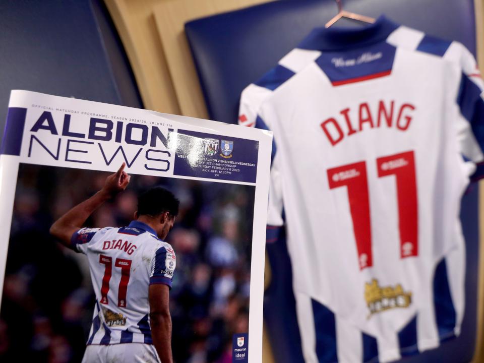 An image of Diangana on the cover of the programme, with his shirt behind