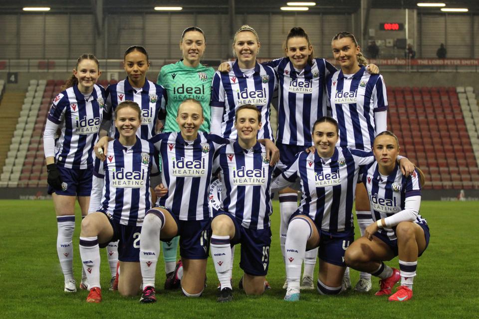 Albion Women line up for a team phot before their game at Man United