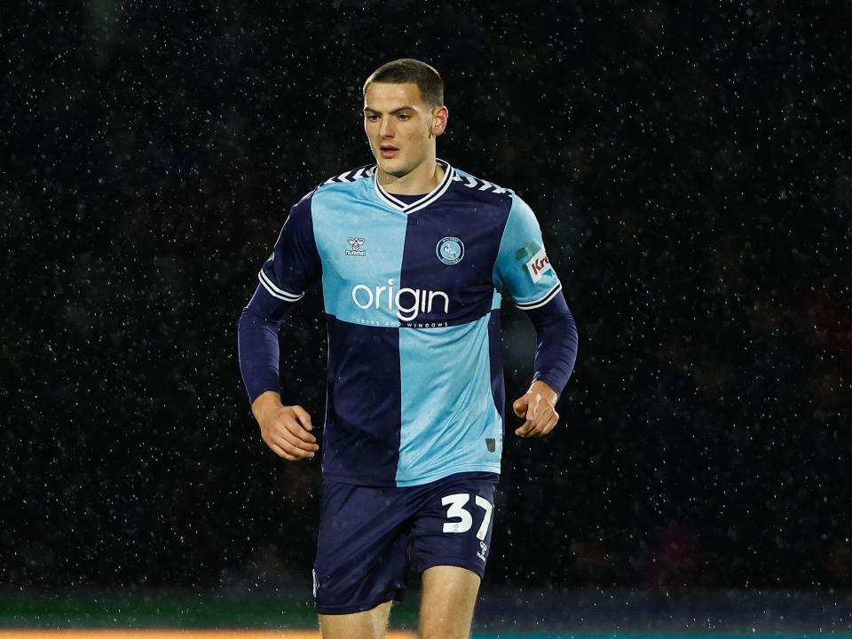 Caleb Taylor in action for Wycombe Wanderers in their home kit 