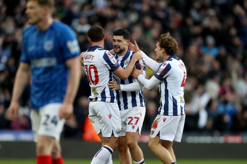 Alex Mowatt celebrates scoring against Portsmouth in the home kit with John Swift and Callum Styles