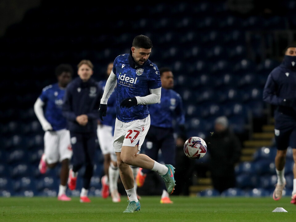 A photo of Alex Mowatt warming up at Turf Moor