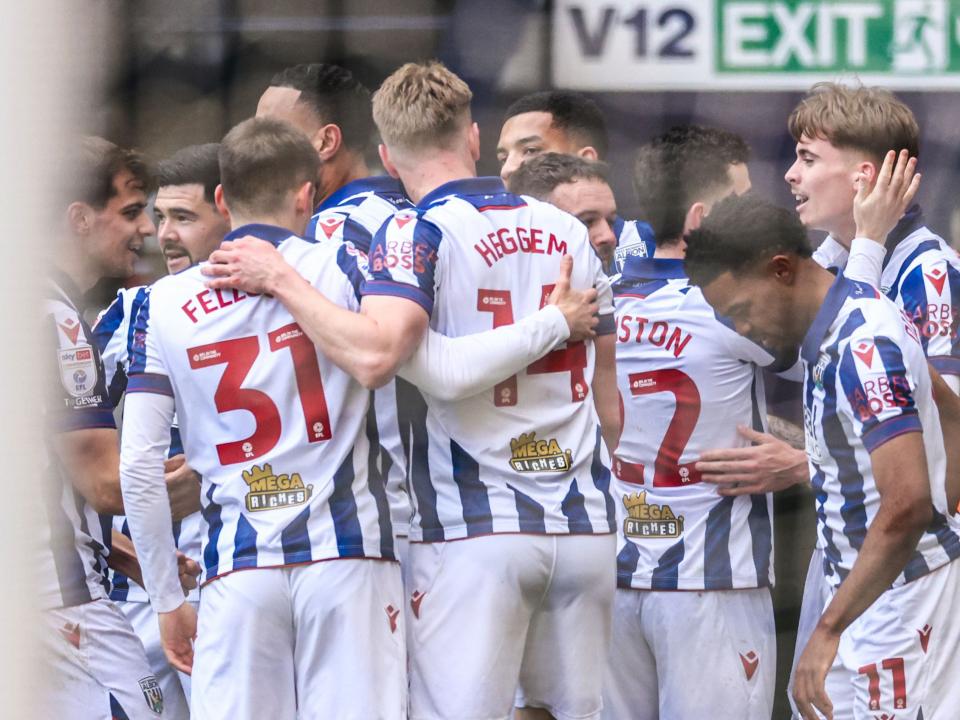Several Albion players celebrate a goal scored at The Hawthorns in the home kit 