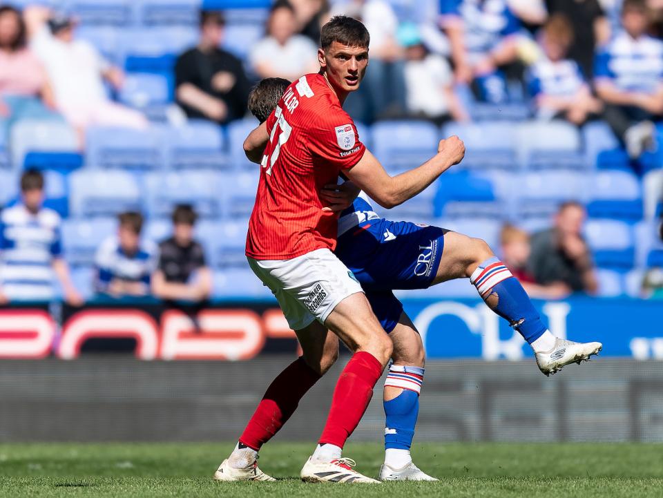 A photo of Caleb Taylor in the red away kit of loan club Wycombe
