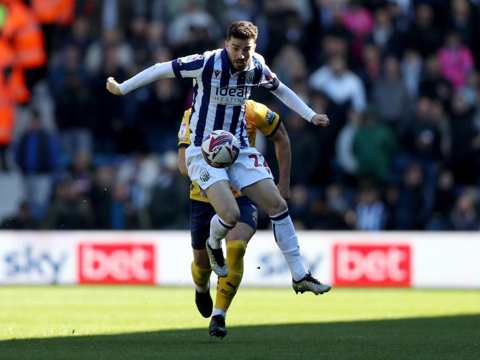 An image of Mikey Johnston on the ball against Derby
