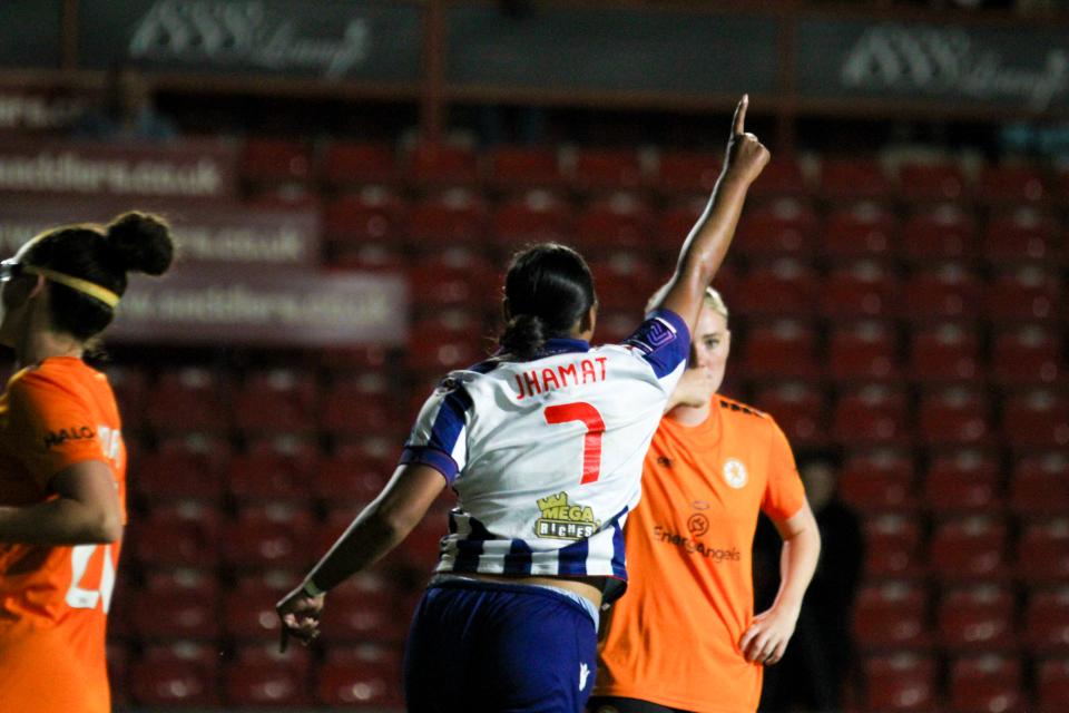 Simran Jhamat celebrates scoring against Rugby in the final at Walsall in the home kit 