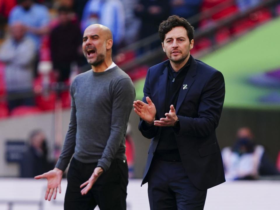 An image of Ryan Mason managing Spurs in the League Cup Final against Pep Guardiola's Man City