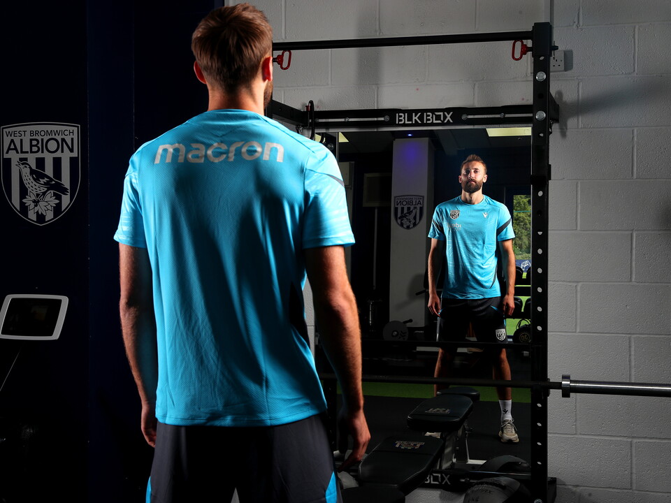 An image of Nat Phillips through a mirror in Albion's training ground gym