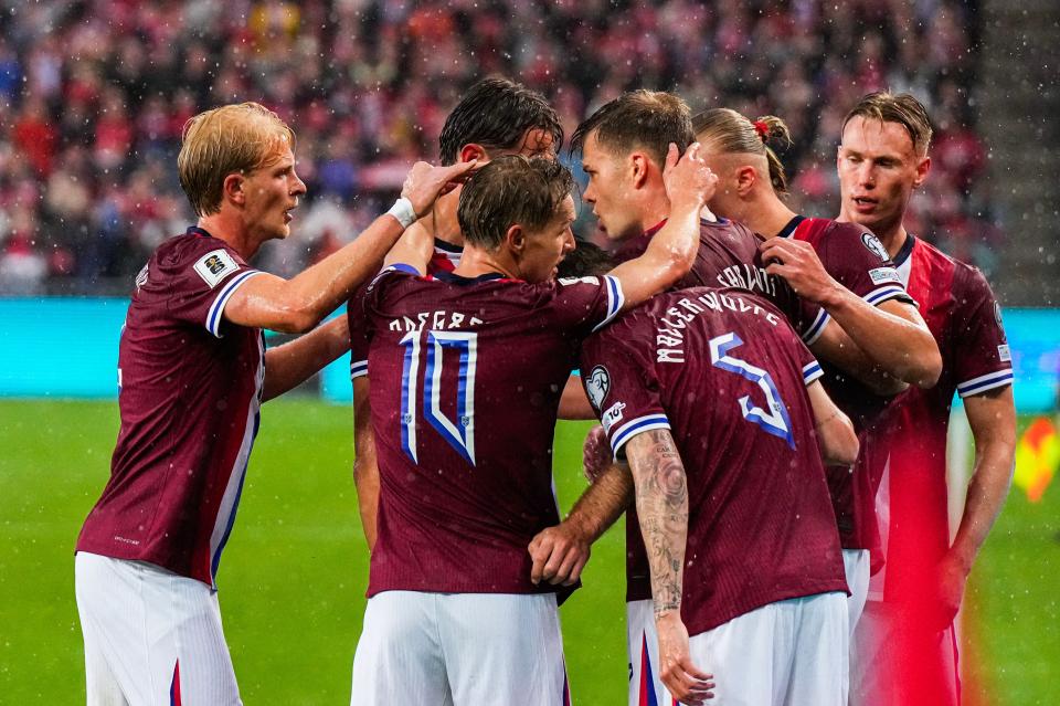 Torbjørn Heggem celebrates with Norway team-mates after a goal against Italy