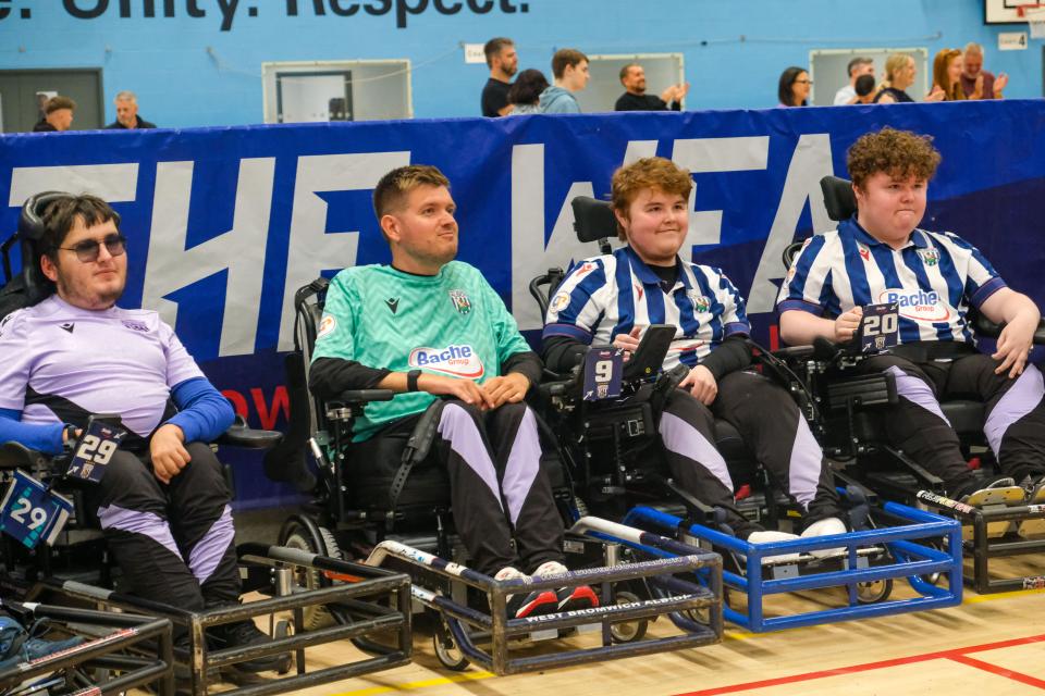 Albion Powerchair pose for a photo.