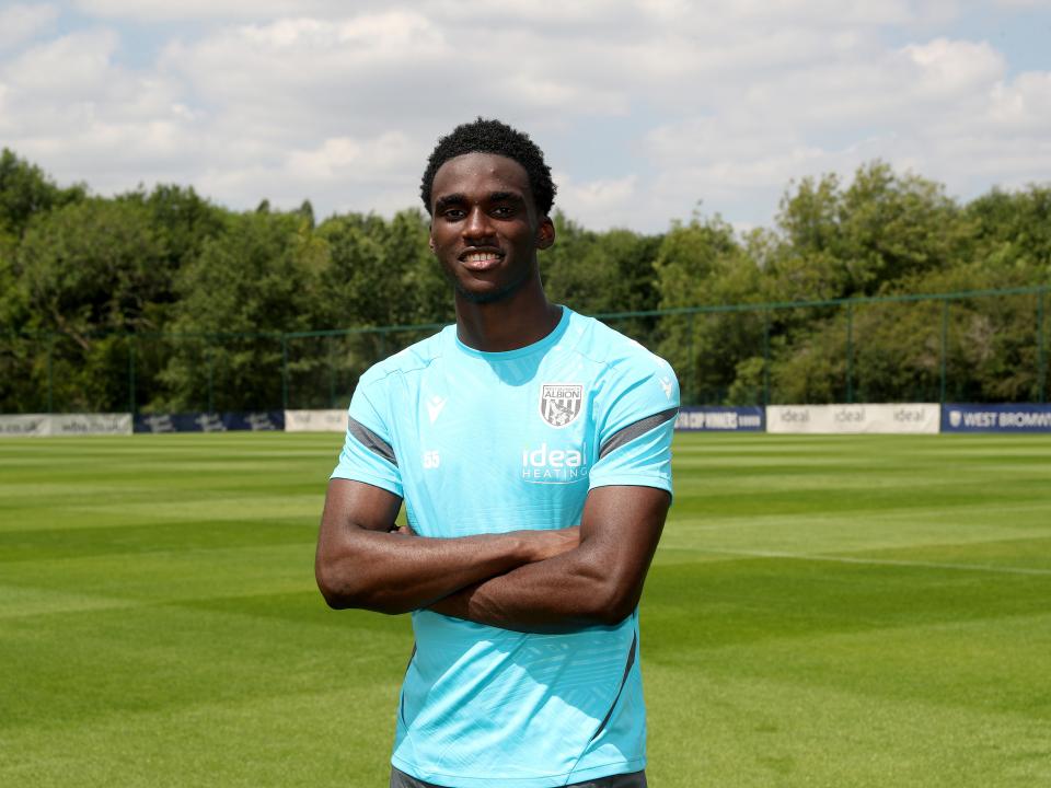 A photo of Dan Chimeziri signing his first professional Albion contract