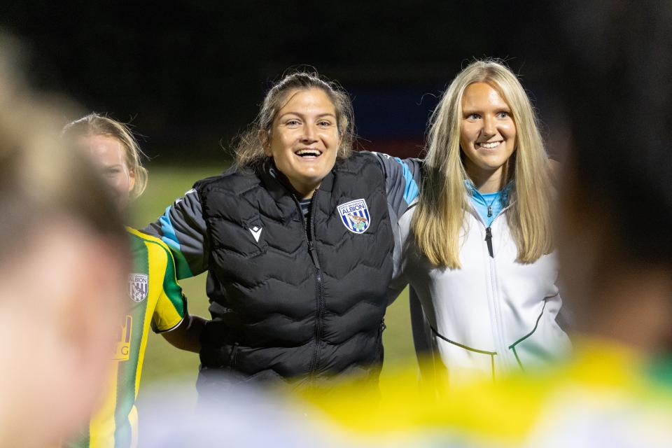 Siobhan Hodgetts-Still smiling while in a team huddle