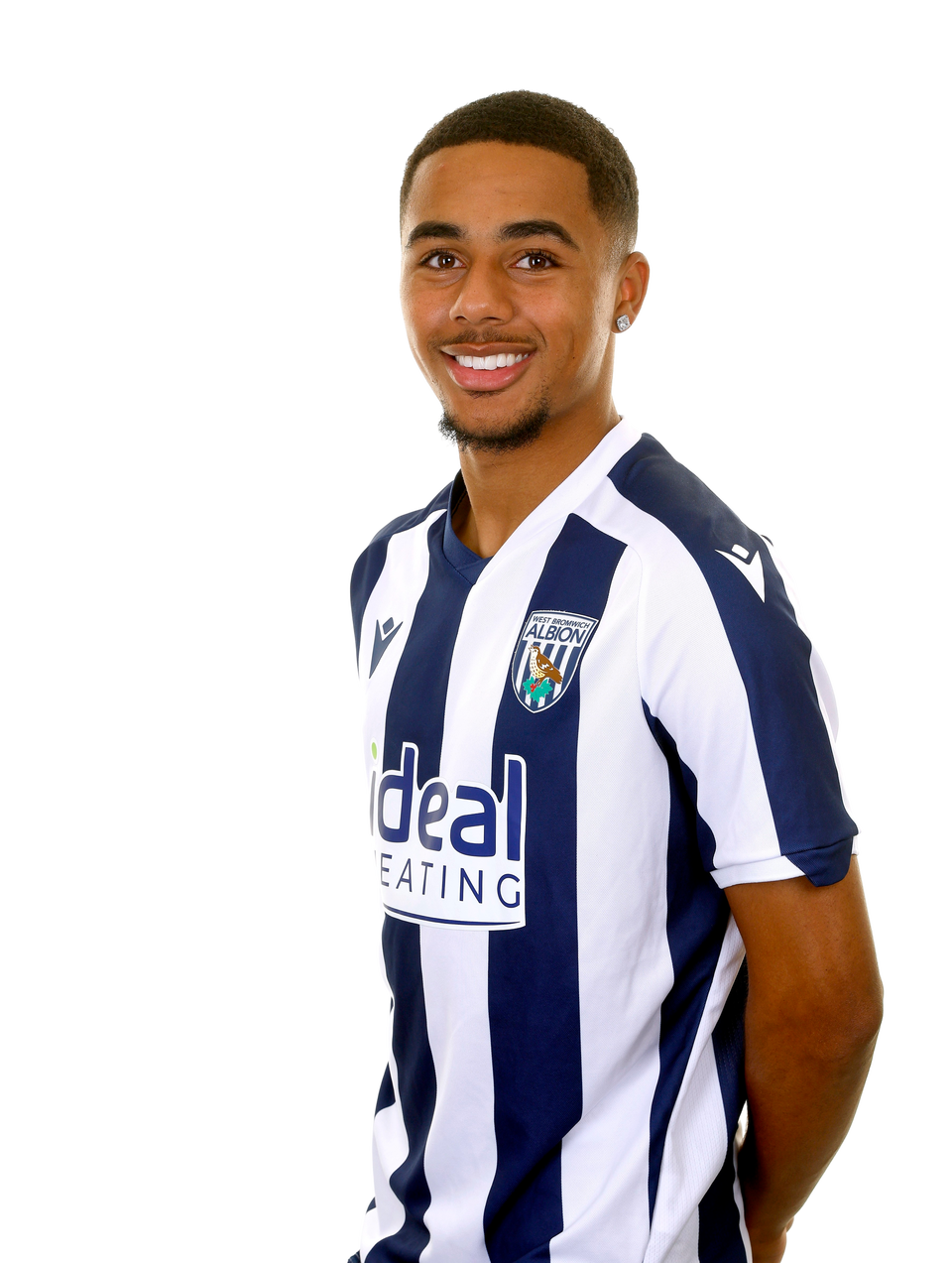 A photo of Albion U21 defender Deago Nelson in the 2025/26 home kit