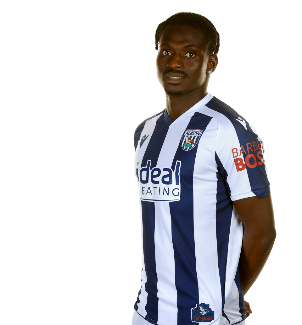 A photo of Albion midfielder Ousmane Diakité in the 2025/26 home kit