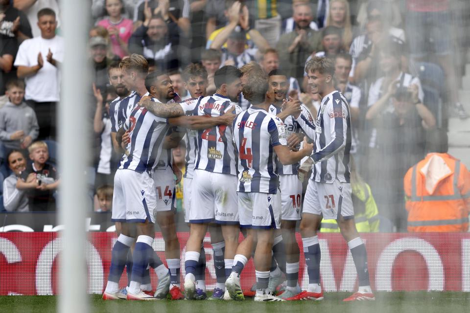 Several Albion players celebrate a goal scored by Isaac Price against Blackburn in the home kit at The Hawthorns