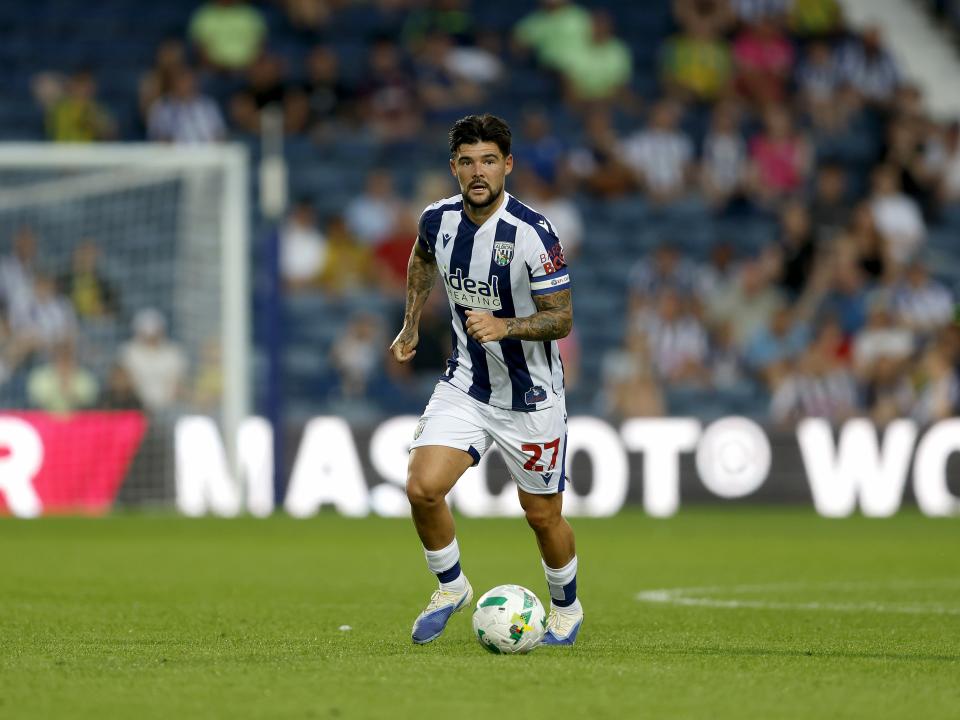 An image of Alex Mowatt on the ball
