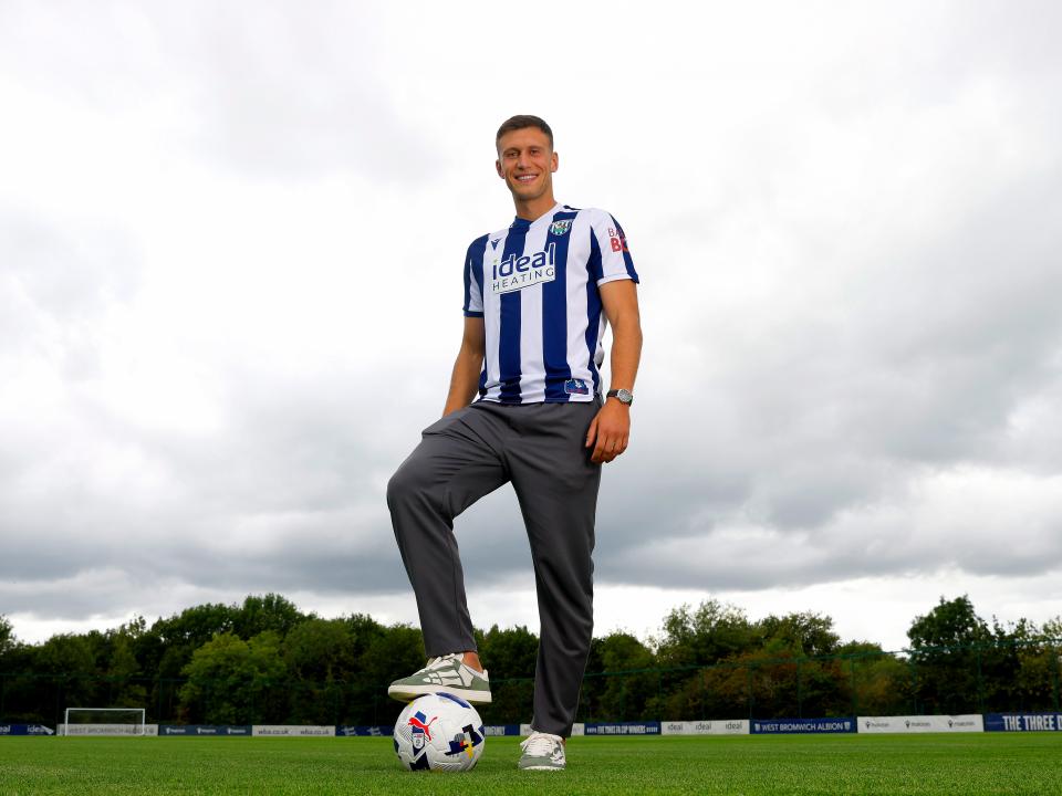 A photo of Albion defender Krystian Bielik in the 2025/26 home kit