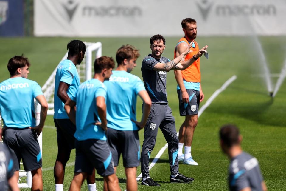 Ryan Mason stood in a line with several players delivering instructions