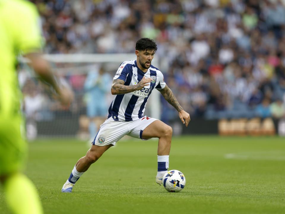 A photo of Alex Mowatt in the 2025/26 home kit