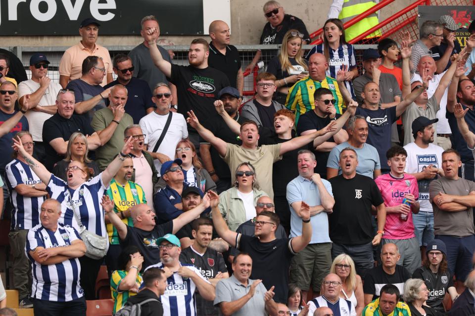 A general view of WBA fans cheering in the stand at a game 