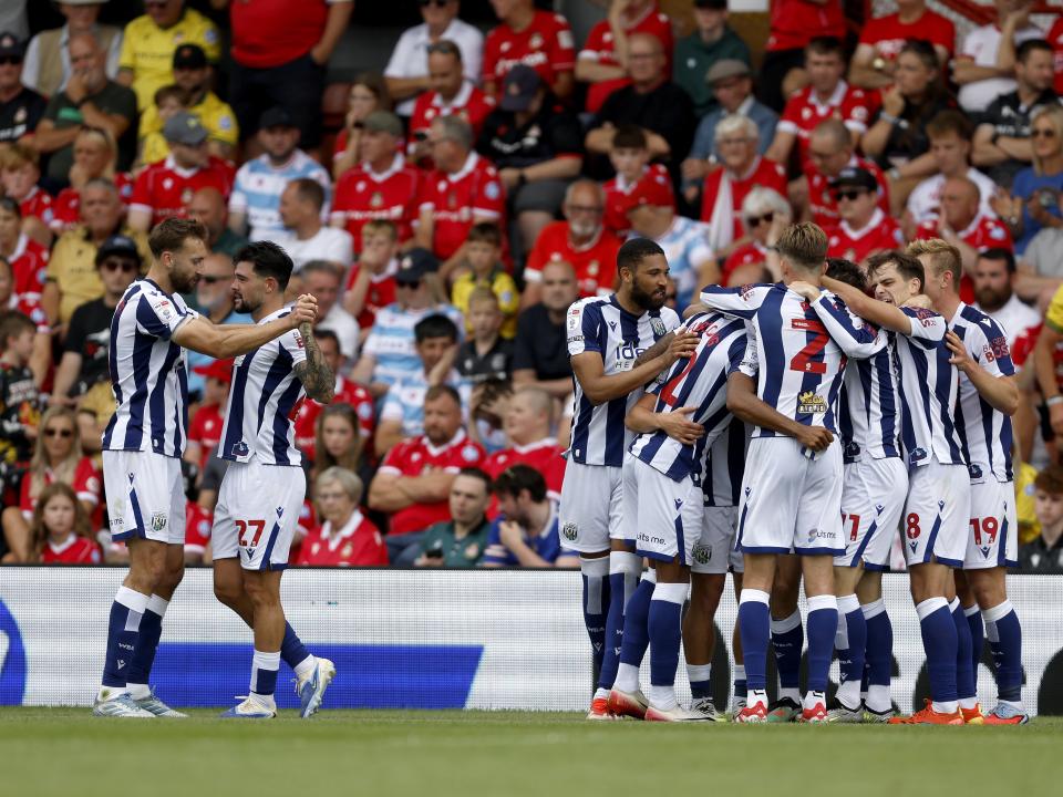 An image of Albion celebrating Wallace's goal against Wrexham