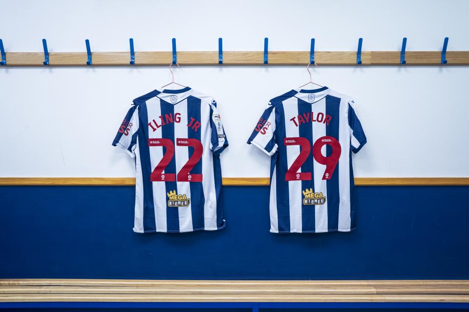 Samuel Iling-Junior's number 22 shirt and Charlie Taylor's number 29 shirt hanging in the dressing room