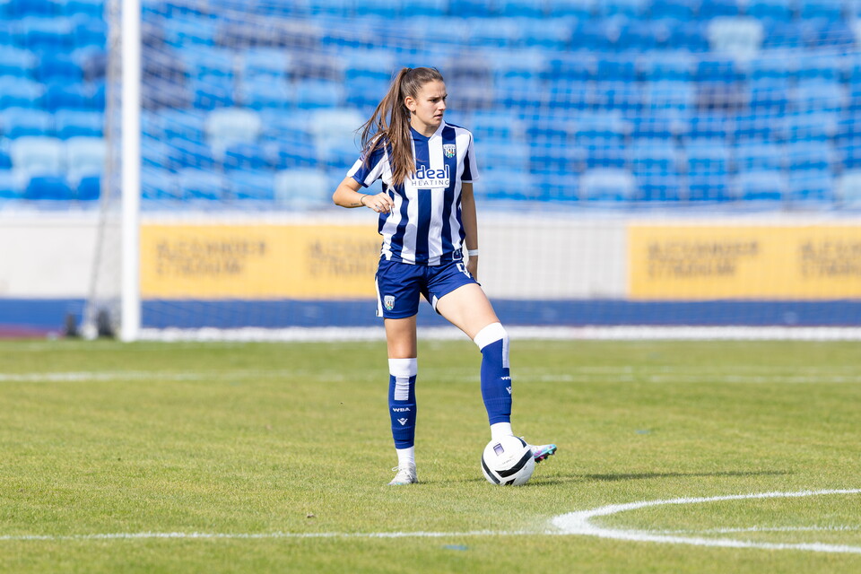 Izzy Green on the ball while during a game for WBA Women in the home kit 