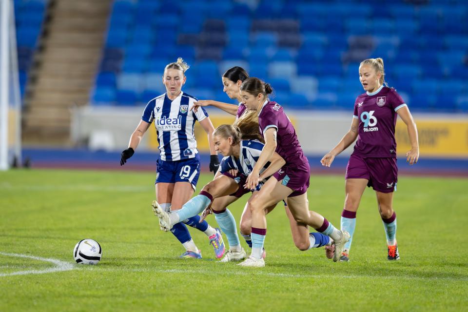 General match action with several players going for the ball between WBA Women and Burnley 