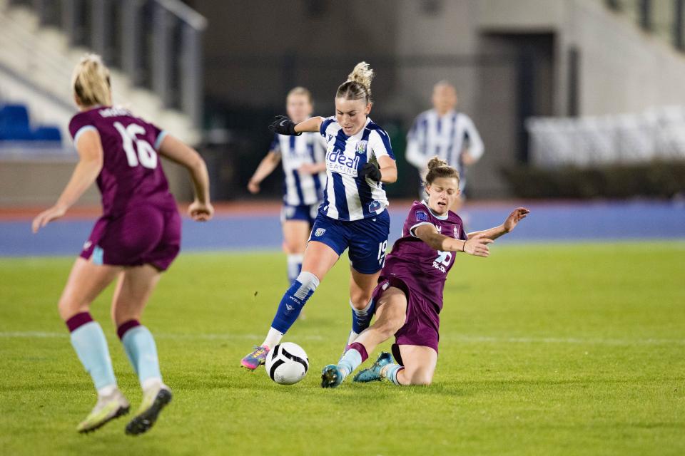 Monique Robinson battling for possession.