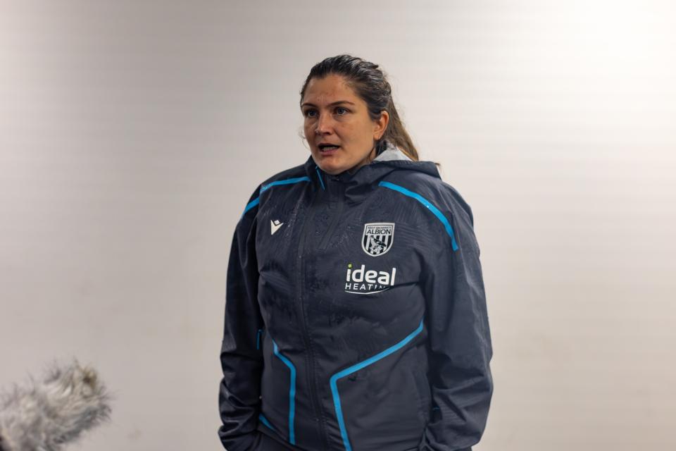Siobhan Hodgetts-Still being interviewed after a game in a WBA tracksuit 
