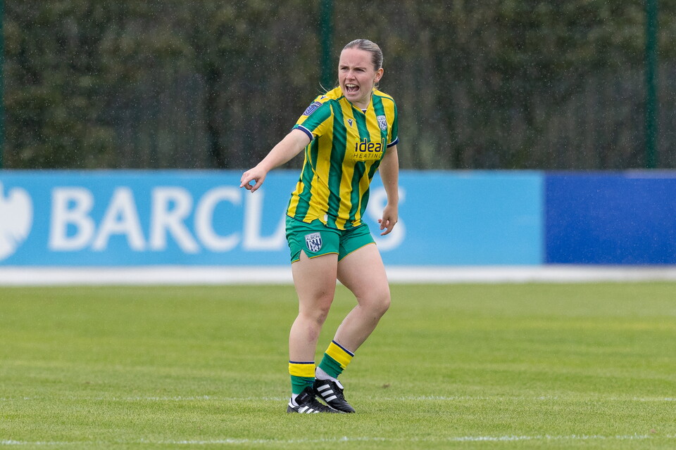 Ella Haughey in action for WBA Women in the green and yellow away 
