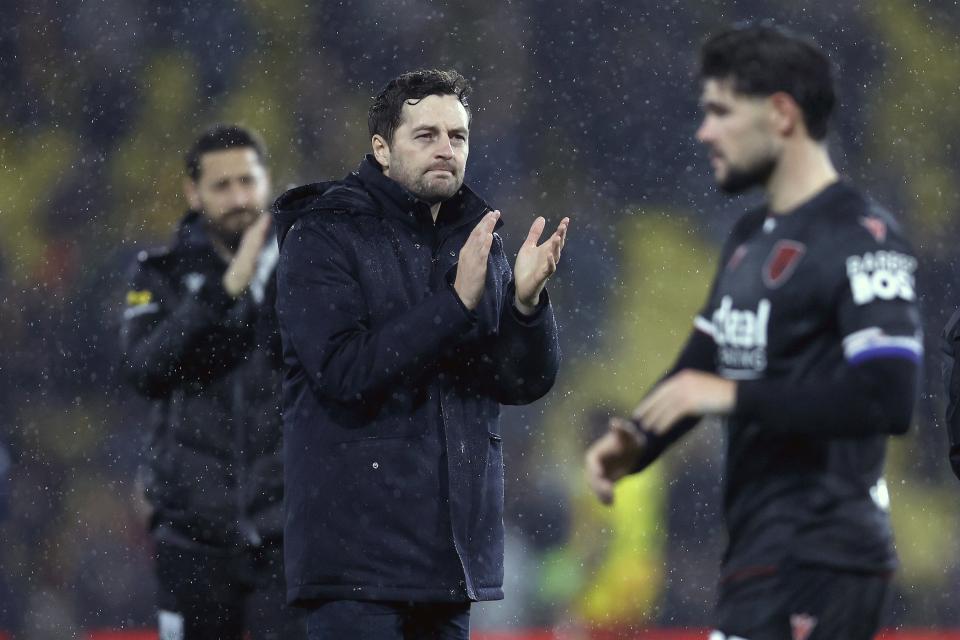Ryan Mason applauding WBA fans in the rain at Watford 