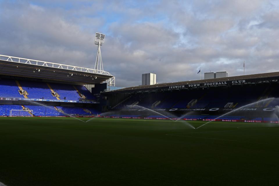 A general view of Portman Road in the sun with sprinklers on the pitch
