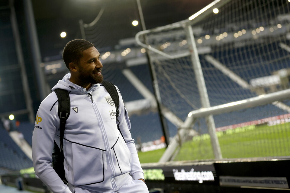 George Campbell arriving at The Hawthorns in a white club tracksuit 