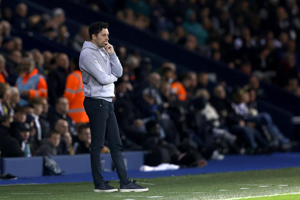 Ryan Mason watching WBA while stood on the side of the pitch at The Hawthorns 